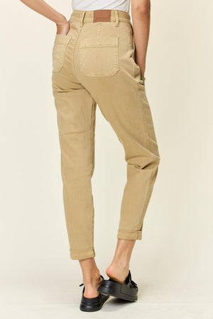 a woman in a white shirt and khaki pants