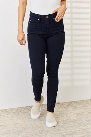 a woman in a white shirt and black pants