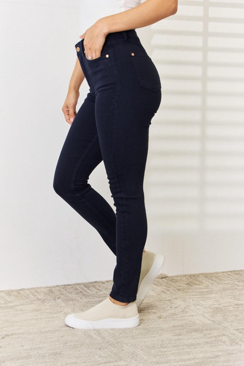 a woman in a white shirt and jeans