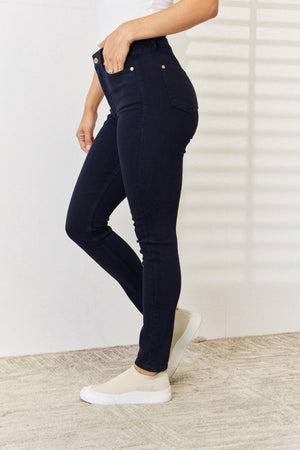 a woman in a white shirt and jeans
