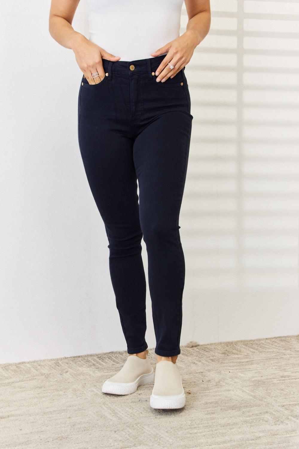 a woman in white shirt and black pants