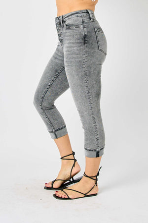 a woman in high heels is posing for a picture