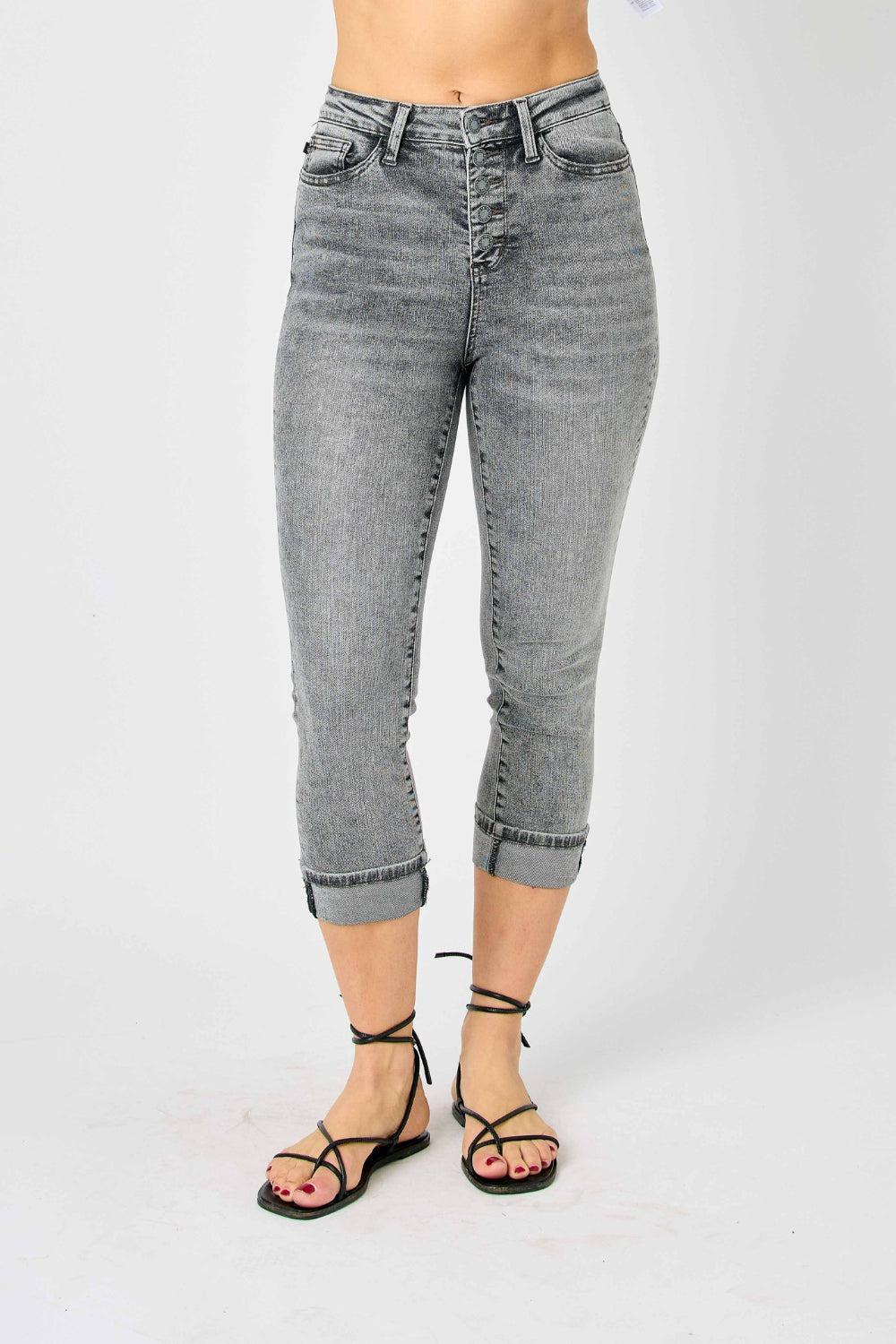 a woman in a white shirt and jeans