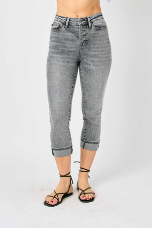 a woman in a white shirt and jeans