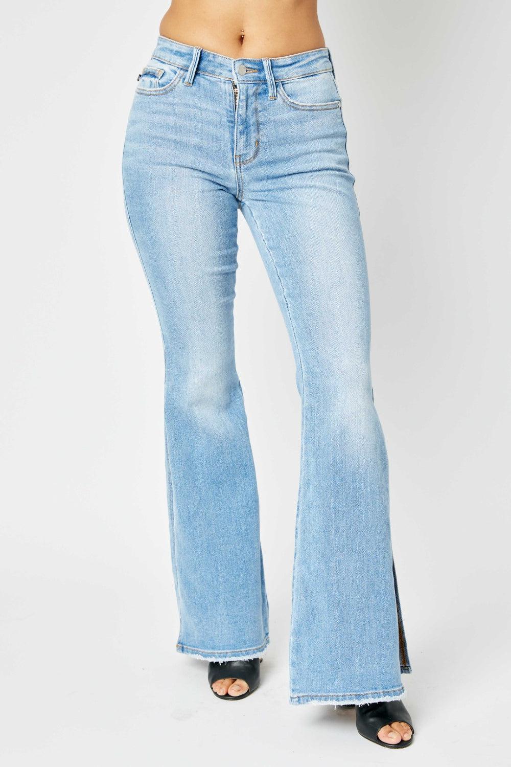 a woman wearing a pair of light blue jeans