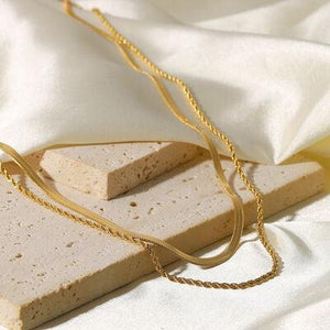 a piece of food sitting on top of a white sheet