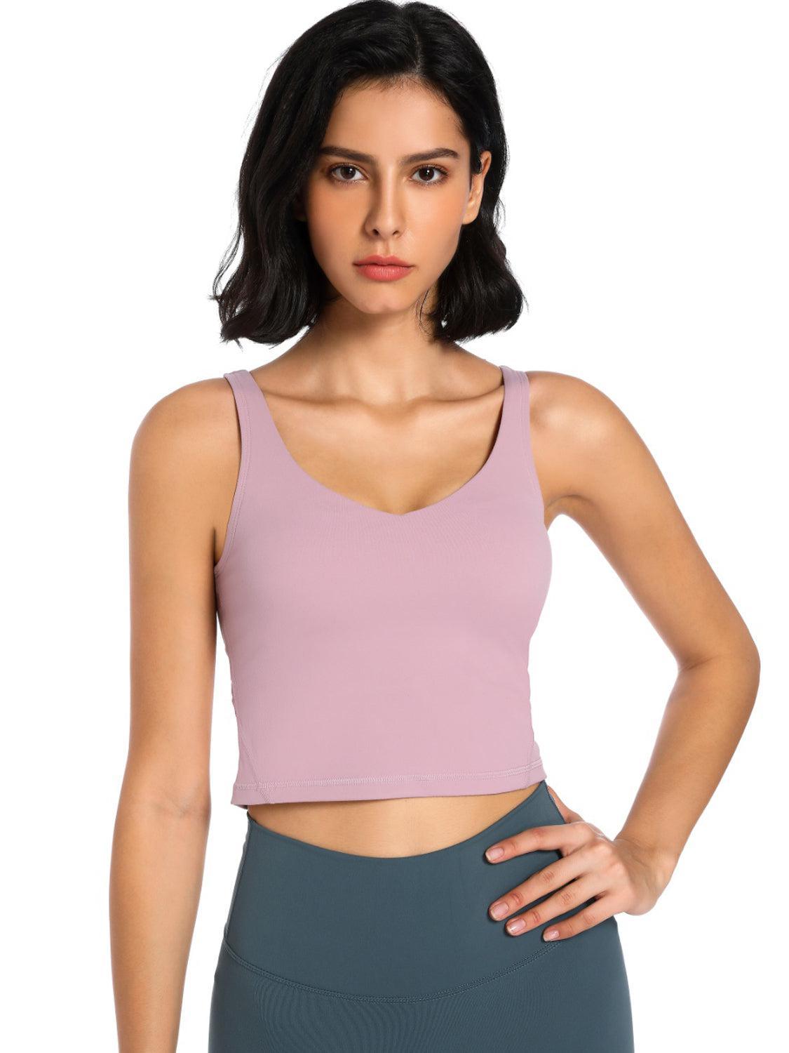 a woman wearing a pink crop top