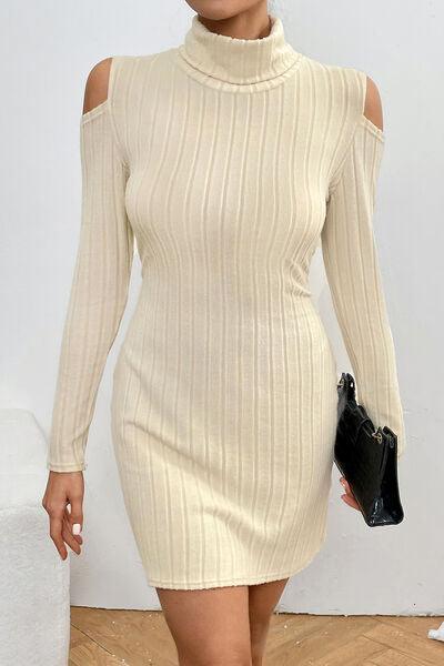 a woman in a white dress is holding a black purse