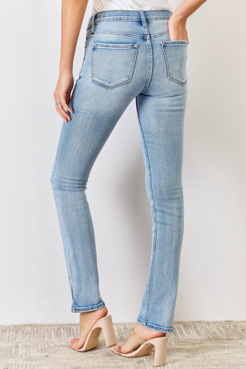 a woman in a white shirt and blue jeans