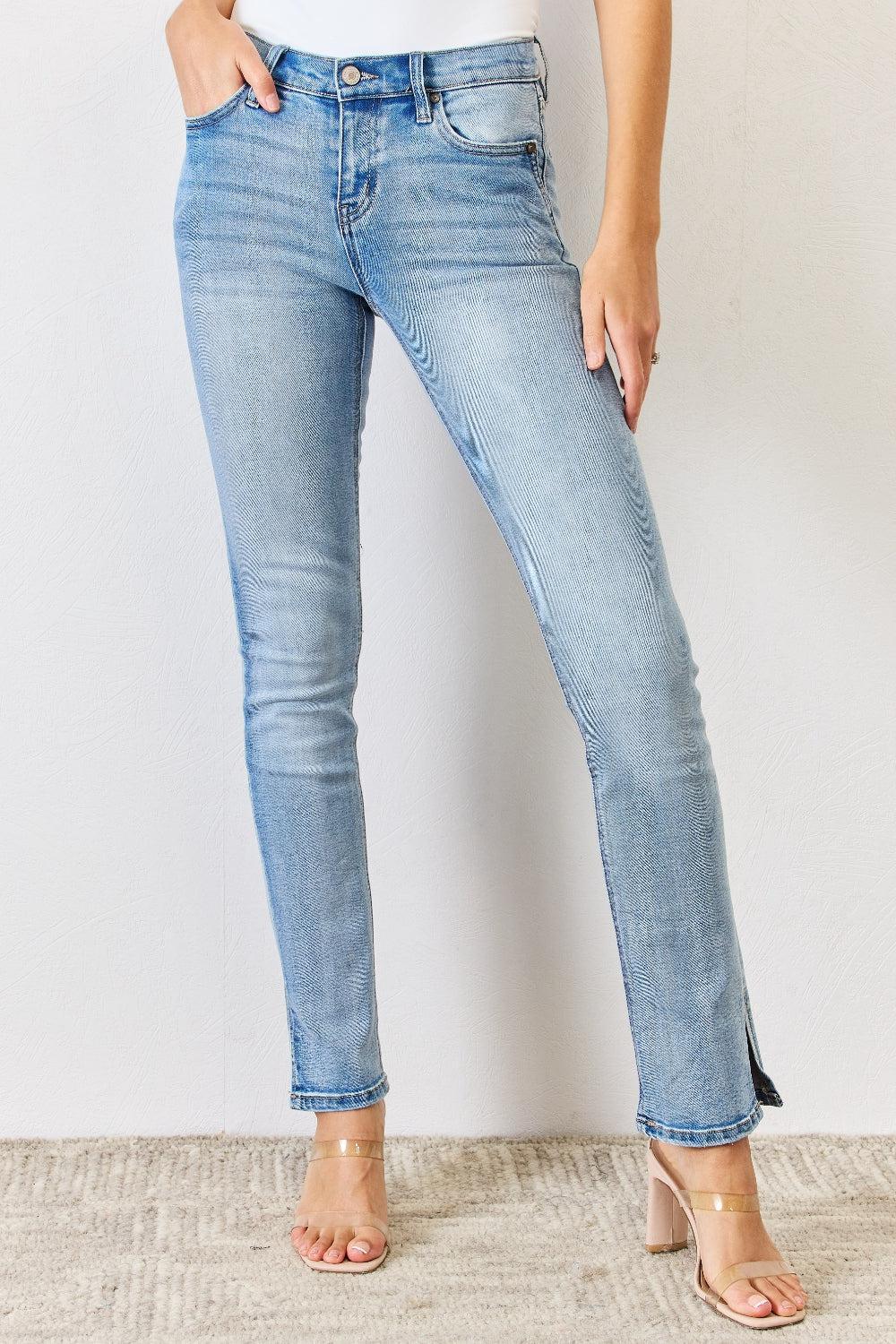 a woman in a white shirt and blue jeans
