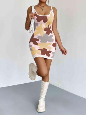 a woman in a camo dress and white boots