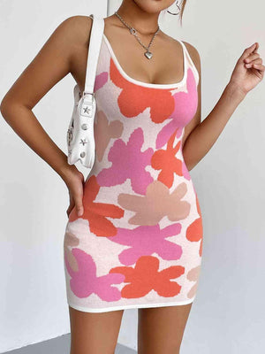 a woman in a pink and orange dress