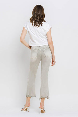 a woman in a white shirt and jeans