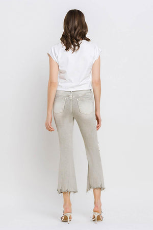 a woman in a white shirt and jeans