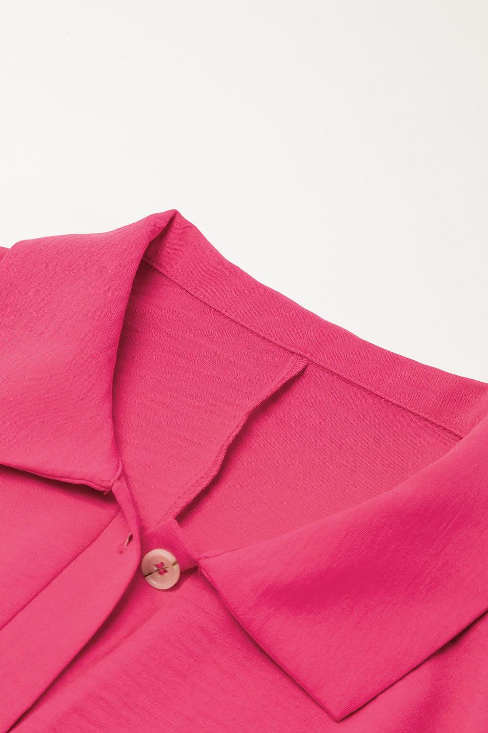 a close up of a pink shirt on a white background
