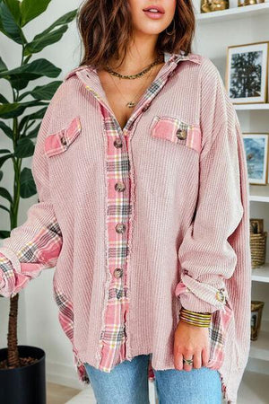 a woman wearing a pink shirt and jeans