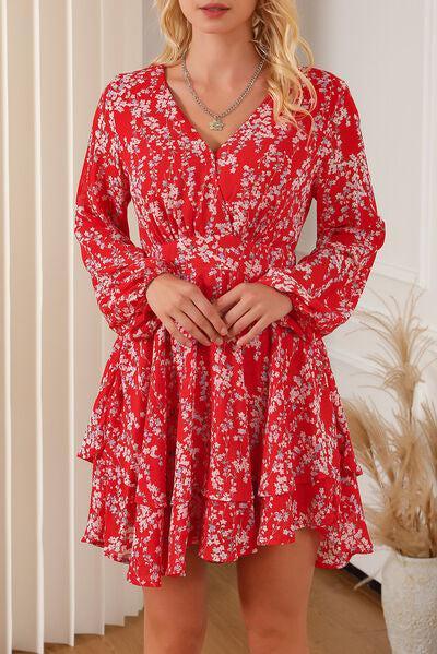 a woman in a red dress posing for a picture