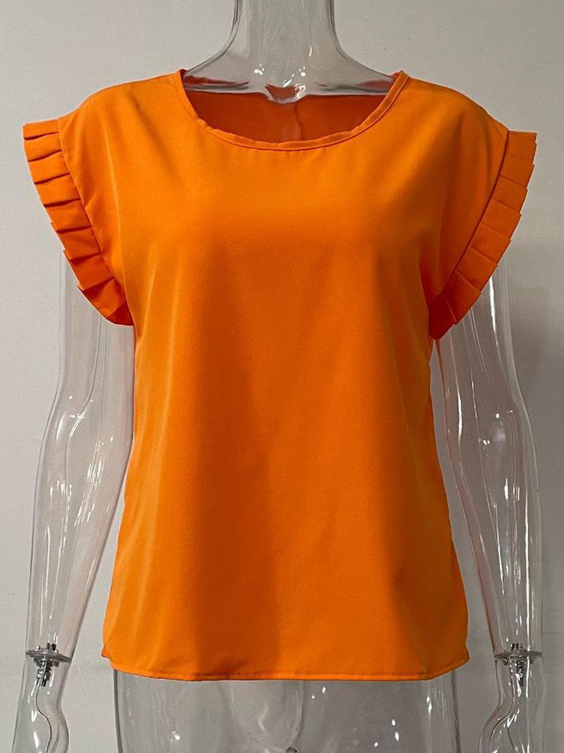 a mannequin wearing an orange top with ruffles