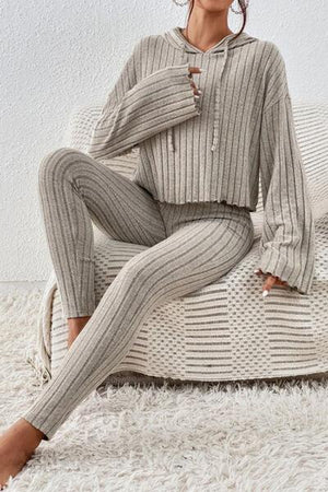 a woman sitting on top of a white couch