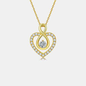 a heart shaped pendant with a diamond in the center
