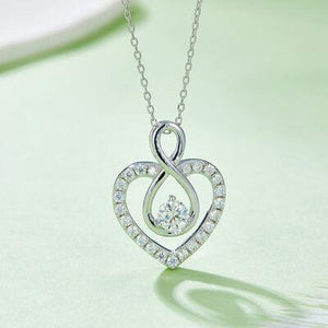 a heart shaped diamond pendant on a chain
