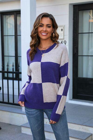 a woman wearing a purple and white checkered sweater