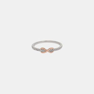 a white and rose gold ring with diamonds