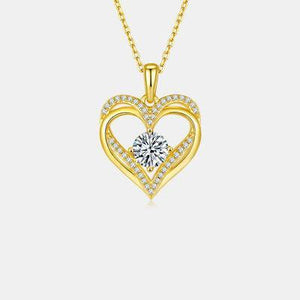 a heart shaped pendant with diamonds on a chain