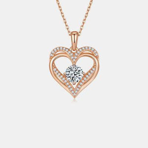 a heart shaped pendant with diamonds on a chain