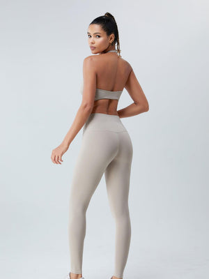 a woman in a beige sports bra top and leggings