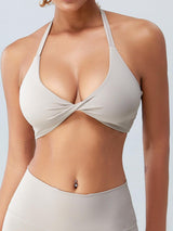 a woman wearing a tan bikini top and panties