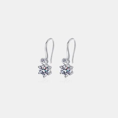 a pair of earrings on a white background