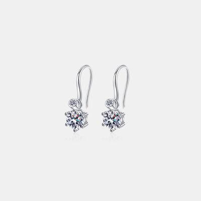 a pair of earrings on a white background