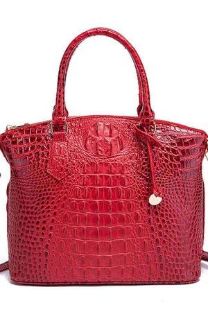 a red handbag with a handle on a white background