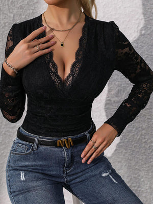 a woman wearing a black top and jeans