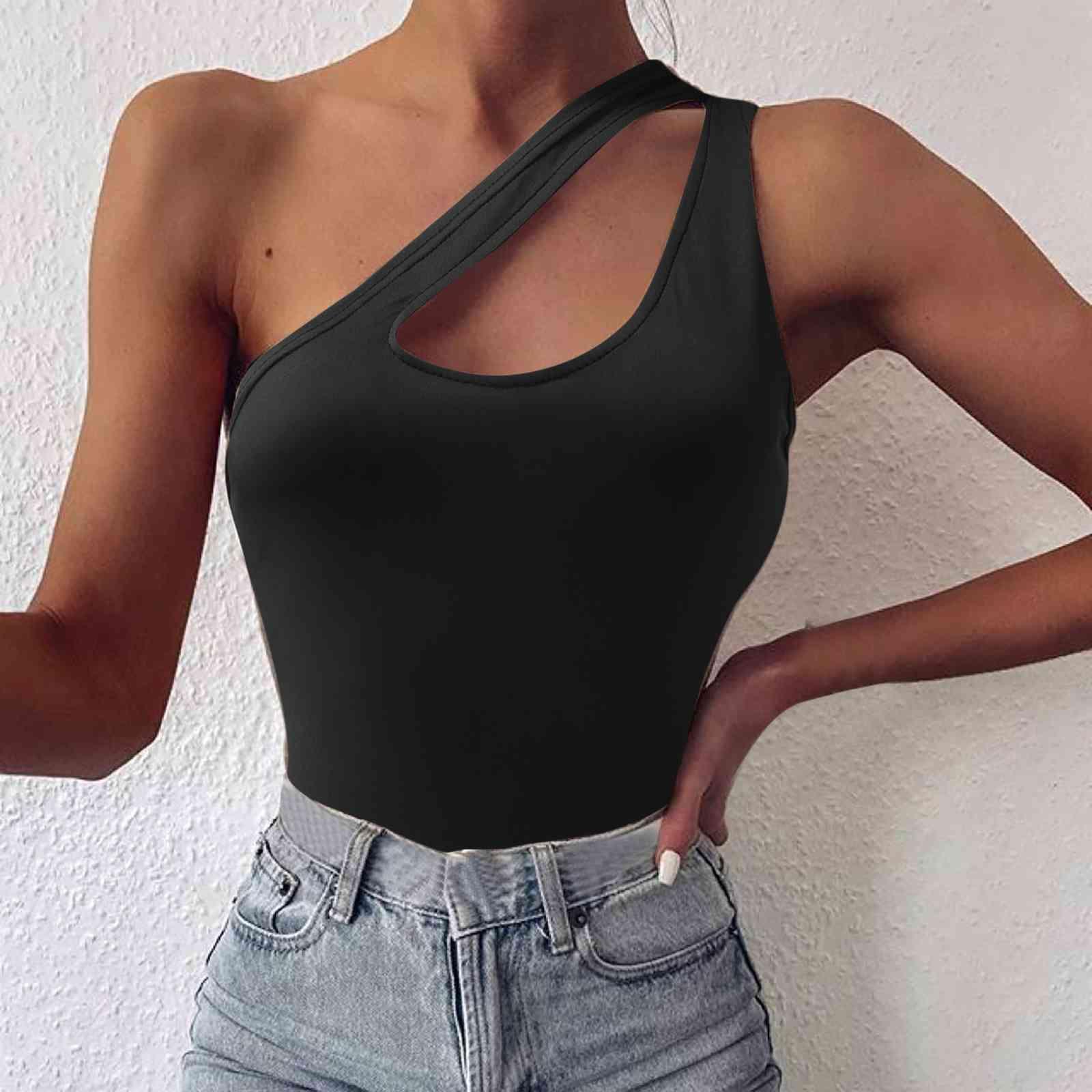 a woman wearing a black top and jeans