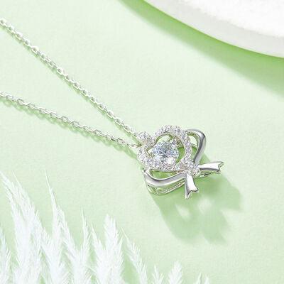 a necklace with a heart and a cross on it