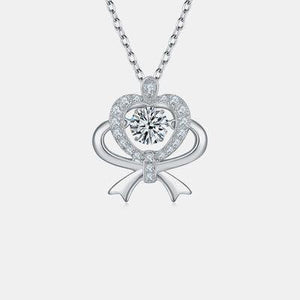 a necklace with a heart shaped diamond on a chain