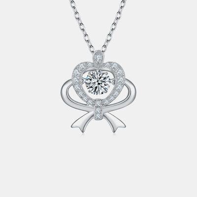 a necklace with a heart shaped diamond on a chain