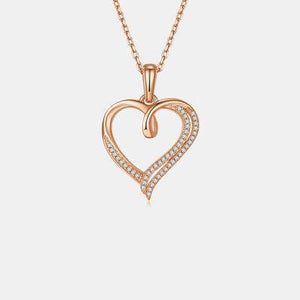 a diamond heart pendant on a chain