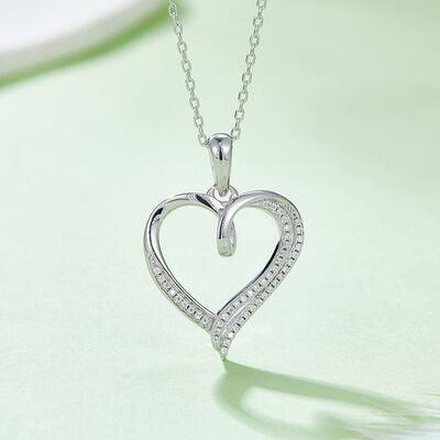 a diamond heart pendant on a chain