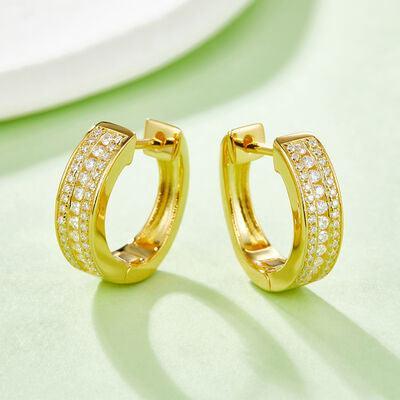 a pair of yellow gold hoop earrings with diamonds