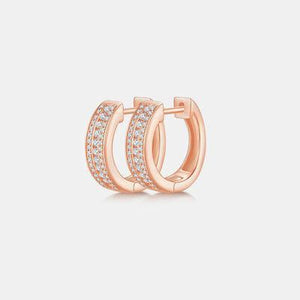 a pair of rose gold hoop earrings with diamonds