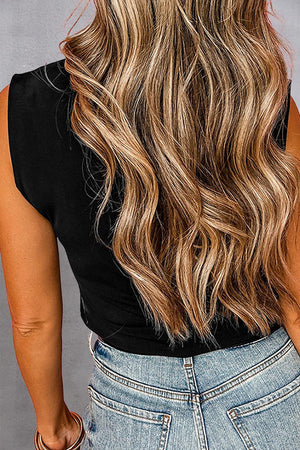 the back of a woman's head with long, wavy hair