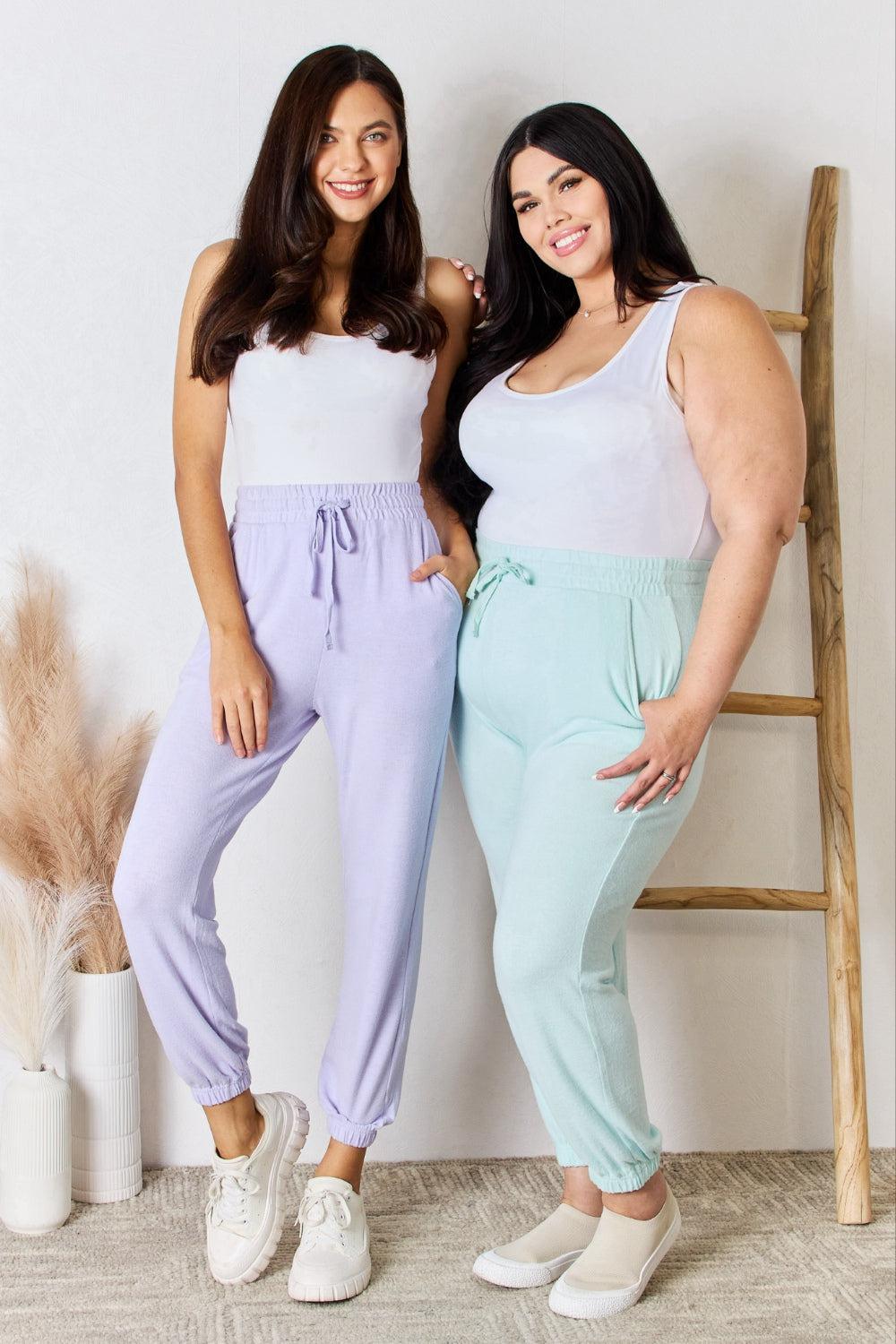 two women standing next to each other posing for a picture