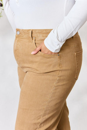 a woman in a white shirt and tan pants
