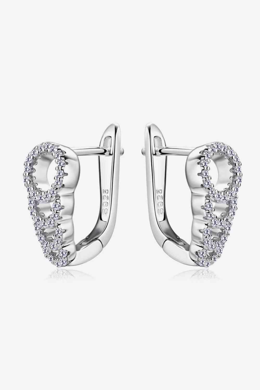 a pair of white gold earrings with diamonds