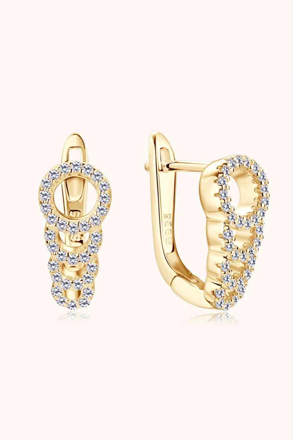 a pair of yellow gold earrings with diamonds