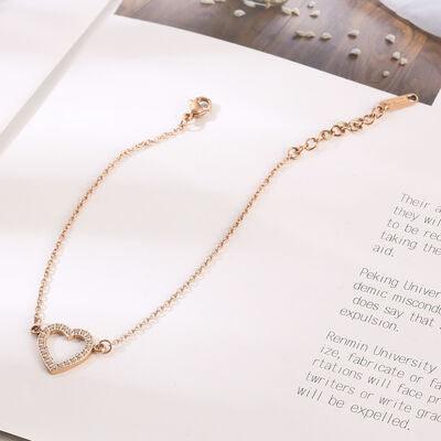 a book with a chain and a heart charm on it