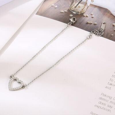 a close up of a book with a necklace on it